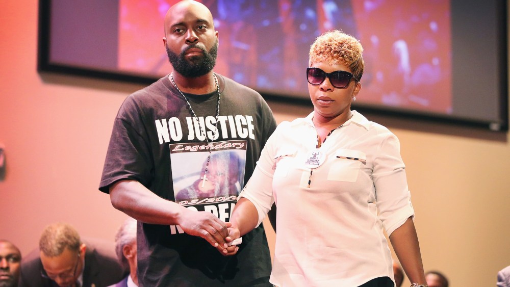 Michael Brown Sr. and Lesley McSpadden, the parents of slain teenager Michael Brown, attend a rally at Greater Grace Church on Aug. 17, 2014 in Ferguson, Mo. (Photo by Scott Olson/Getty)