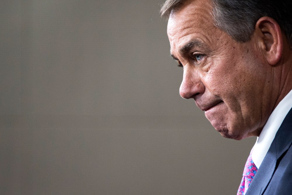 Speaker of the House John Boehner, R-OH, answers questions from reporters during his weekly briefing on Capitol Hill in Washington, D.C., Dec. 5, 2013. (Photo by Jim Watson/AFP/Getty)