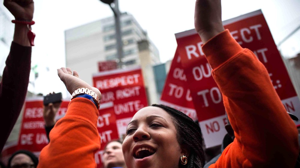 Protesters rally outside of a Wendy's in support of raising fast food wages from $7.25 per hour to $15.00 per hour on Dec. 5, 2013 in the Brooklyn borough of New York City.