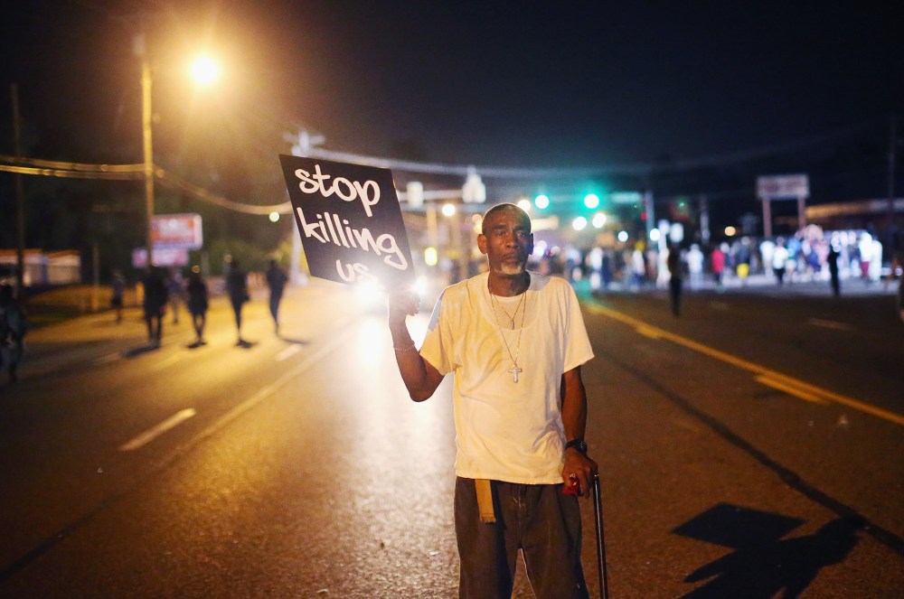 Frederick Scott protests the killing of teenager Michael Brown on Aug. 18, 2014 in Ferguson, Mo.