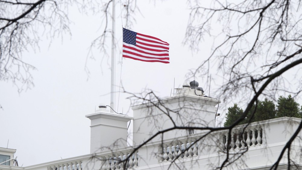 The US flag flies at half staff over the White House in honor of former South African President Nelson Mandela in Washington, DC, on December 6, 2013.
