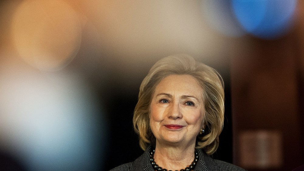 Hillary Clinton listens to a speaker before receiving the 2013 Lantos Human Rights Prize in Washington, Dec. 6, 2013.