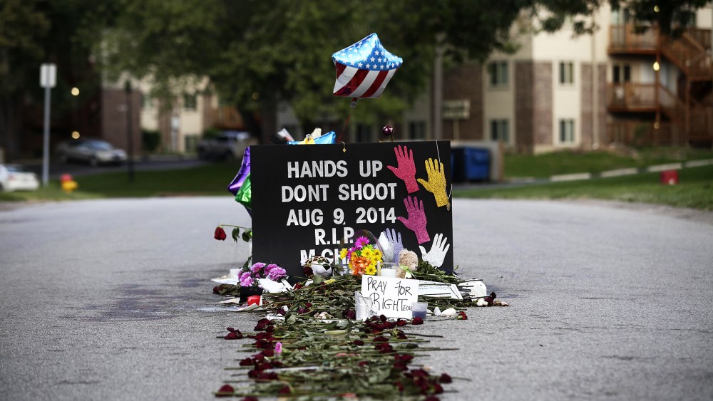 Roses line the street leading to a makeshift memorial for Michael Brown on Aug. 22, 2014 in Ferguson, Mo.