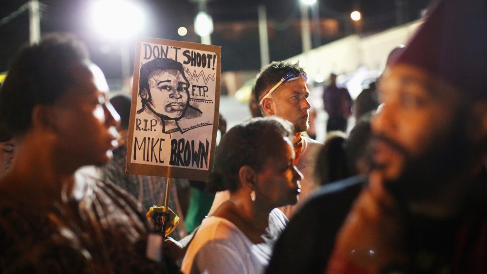 Demonstrators protest the shooting death of Michael Brown on Aug. 23, 2014 in Ferguson, Mo.