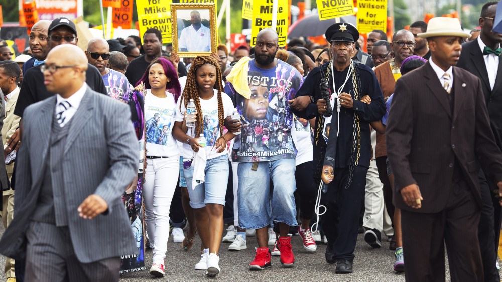 Michael Brown Sr. joins demonstrators at a rally for his son Michael Brown on August 30, 2014 in Ferguson, Missouri.