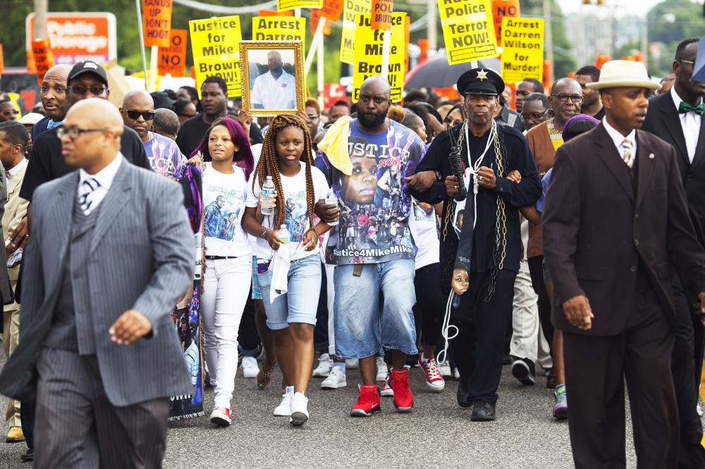 Michael Brown Sr. joins demonstrators at a rally for his son Michael Brown on August 30, 2014 in Ferguson, Missouri.