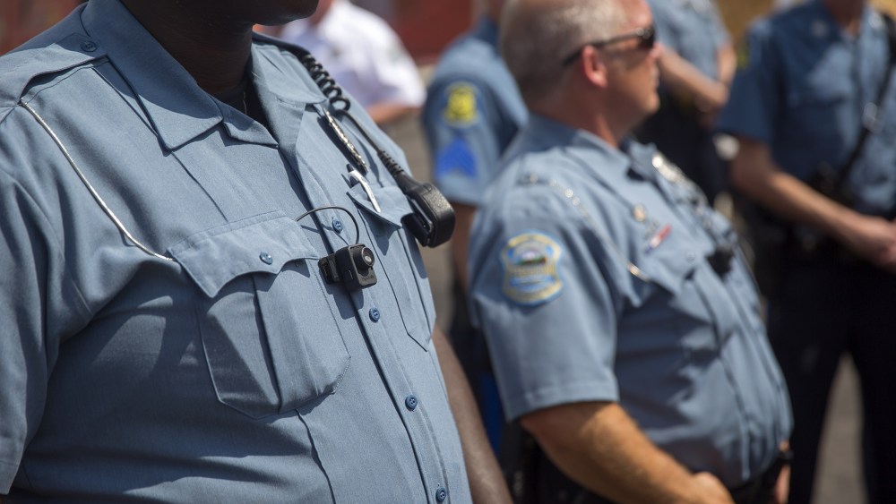 Members of the Ferguson Police department are seen during a rally on Aug. 30, 2014 in Ferguson, Mo. (Photo by Aaron P. Bernstein/Getty)