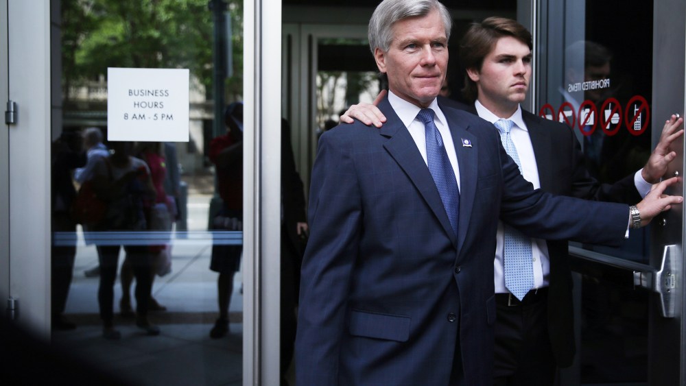 Former Virginia Governor Robert McDonnell (L) leaves U.S. District Court for the Eastern District of Virginia with his son Bobby (R) after jury began their deliberations on his corruption trial Sept. 2, 2014, 2014 in Richmond, Va.