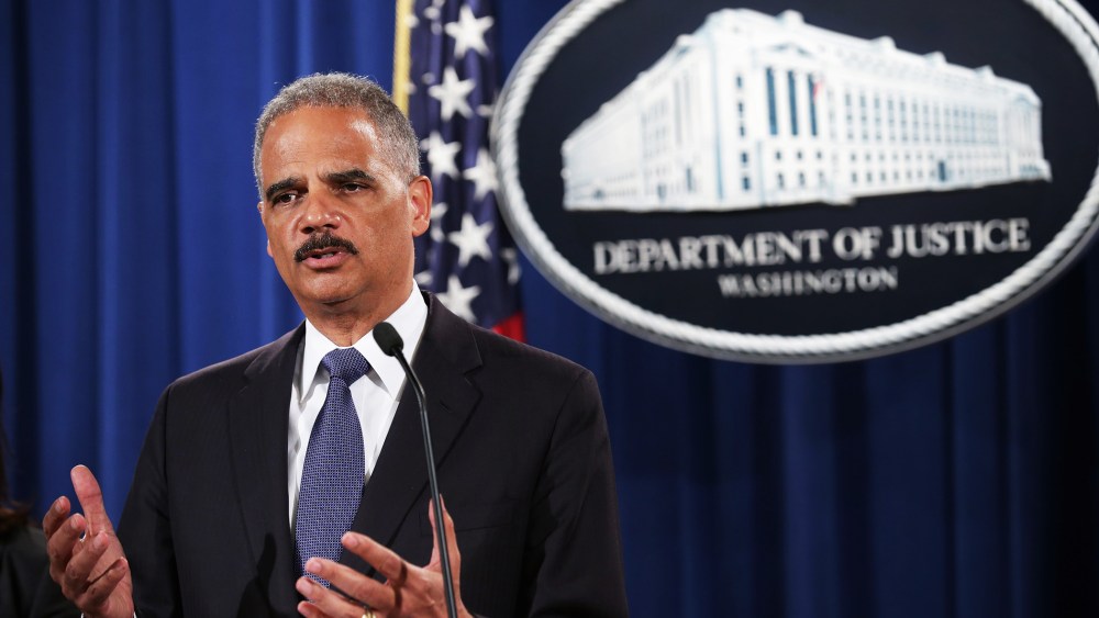 U.S. Attorney General Eric Holder announces a Justice Department 'patterns and practice' investigation of the Ferguson, Missouri, police department during a news conference at the department's headquarters September 4, 2014 in Washington, DC.