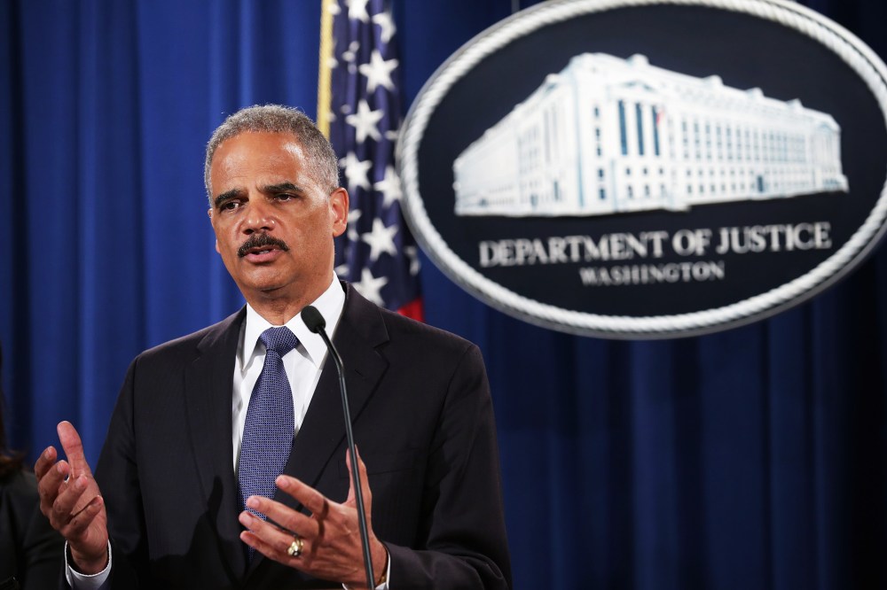 U.S. Attorney General Eric Holder announces a Justice Department 'patterns and practice' investigation of the Ferguson, Missouri, police department during a news conference at the department's headquarters September 4, 2014 in Washington, DC.