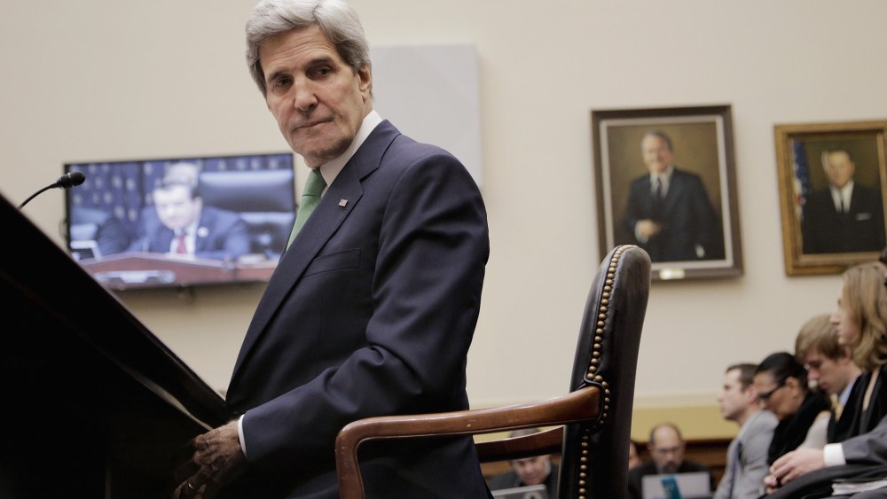 Secretary of State John Kerry waits to testify before the House Foreign Affairs Committee on December 10, 2013 in Washington, D.C.