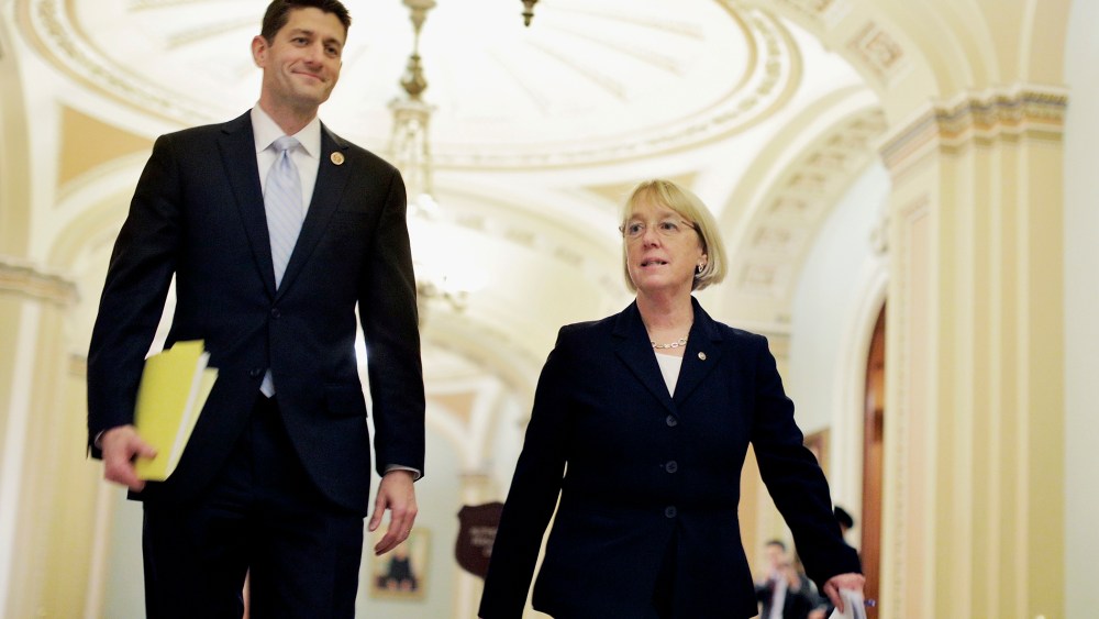 House Budget Committee Chairman Paul Ryan (R-WI) and Senate Budget Committee Chairman Patty Murray (D-WA) walk past the Senate chamber on their way to a press conference to announce a bipartisan budget deal, the Bipartisan Budget Act of 2013, at the U.S.
