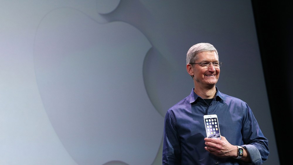 Apple CEO Tim Cook shows off the new iPhone 6 and the Apple Watch during an Apple special event at the Flint Center for the Performing Arts on Sept. 9, 2014 in Cupertino, Calif.