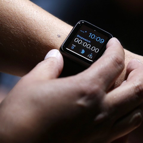 An attendee inspects the new Apple Watch during an Apple special event at the Flint Center for the Performing Arts on September 9, 2014 in Cupertino, Calif. (Photo by Justin Sullivan/Getty)