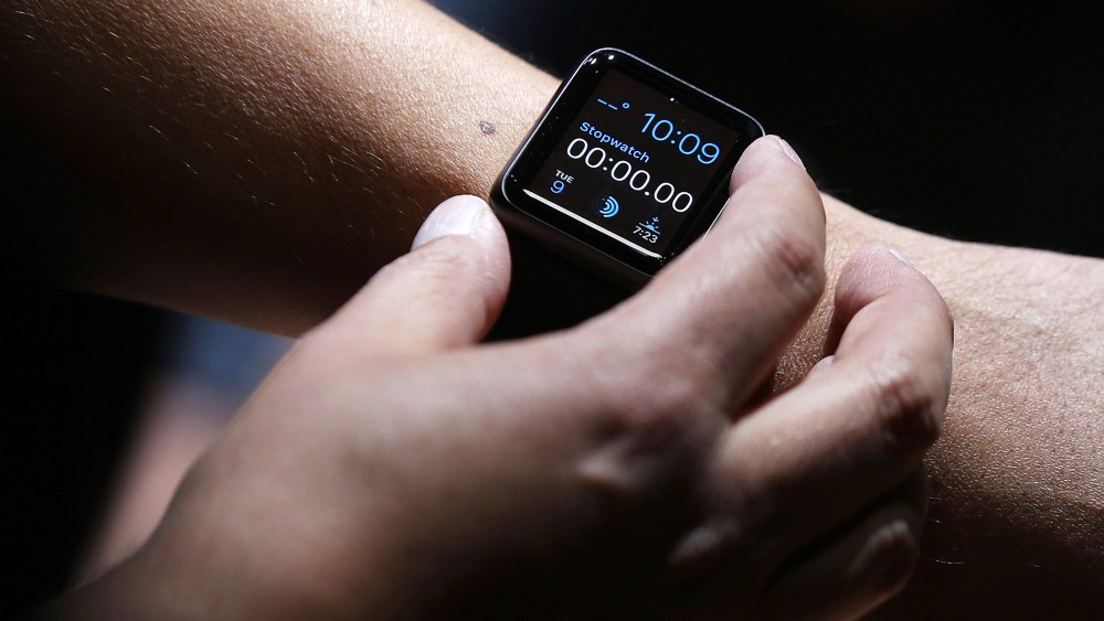 An attendee inspects the new Apple Watch during an Apple special event at the Flint Center for the Performing Arts on September 9, 2014 in Cupertino, Calif. (Photo by Justin Sullivan/Getty)