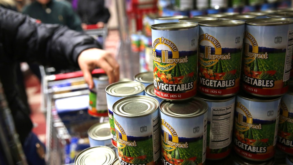 Harlem residents choose groceries at the Food Bank For New York City, Dec. 11, 2013. in New York, N.Y.