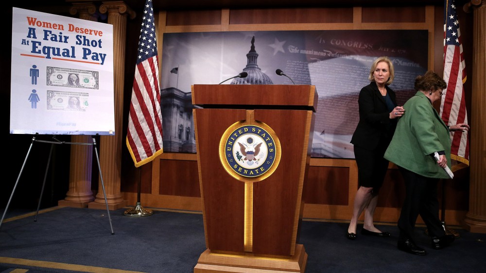 Senators Barbara Mikulski (D-MD) (R) and Kirsten Gillibrand (D-NY) walk away after a news conference on the Paycheck Fairness Act, at the US Capitol, on Sept. 10, 2014 in Washington, DC.