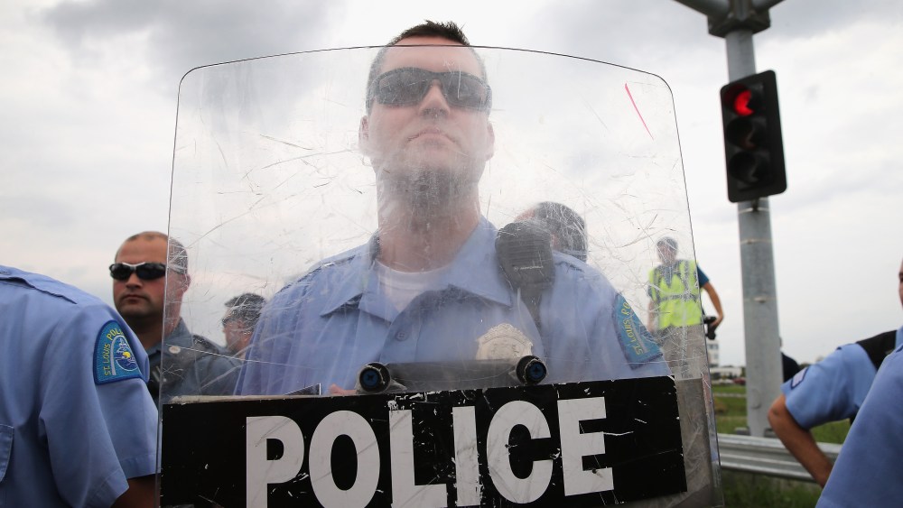Police block demonstrators from gaining access to Interstate Highway 70 on September 10, 2014 near Ferguson, Missouri.