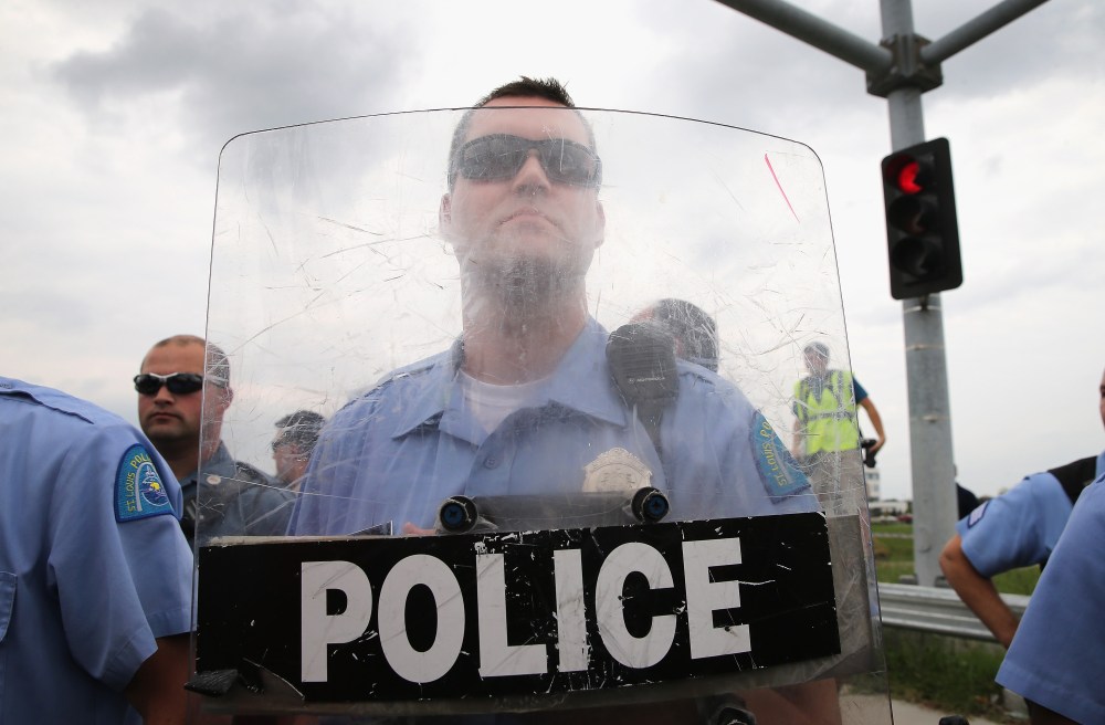Police block demonstrators from gaining access to Interstate Highway 70 on September 10, 2014 near Ferguson, Missouri.
