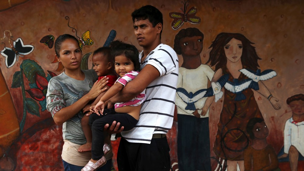 A family of immigrants arrives from Honduras to a shelter for undocumented immigrants on September 15, 2014 in Tenosique, Mexico.