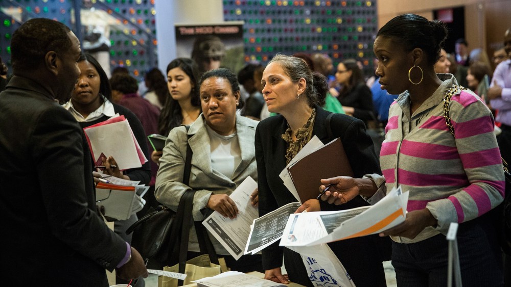 People attend a jobs fair at the Bronx Public Library on Sept. 17, 2014. (Andrew Burton/Getty)