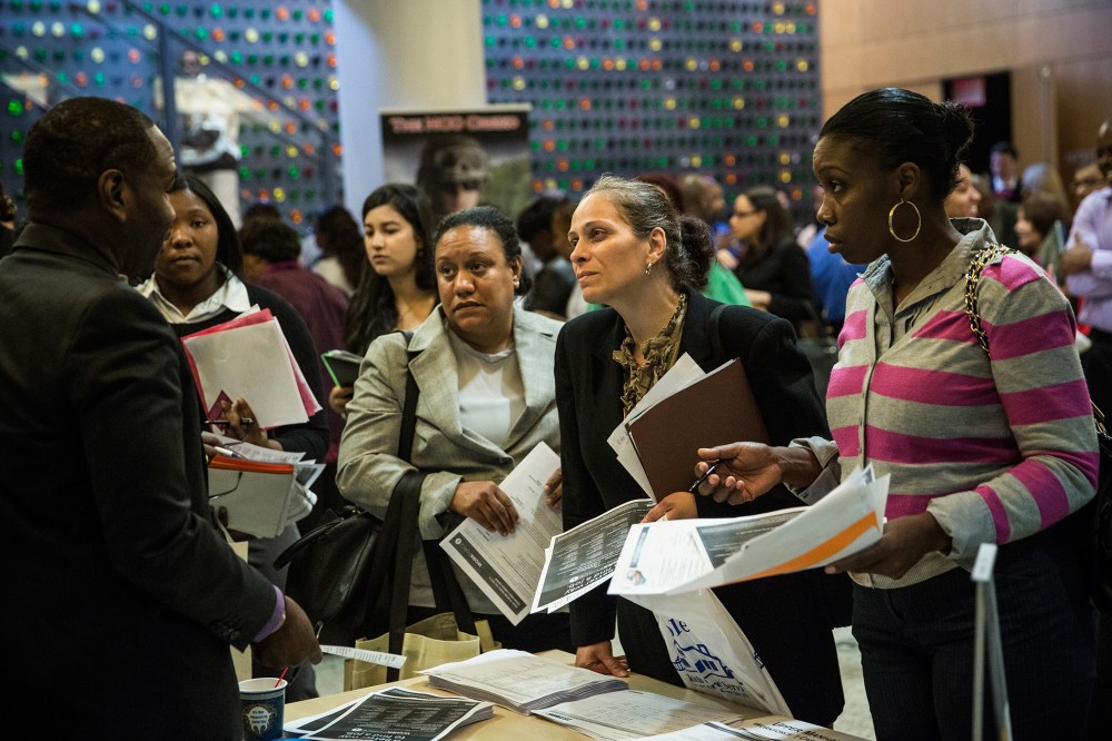People attend a jobs fair at the Bronx Public Library on Sept. 17, 2014. (Andrew Burton/Getty)