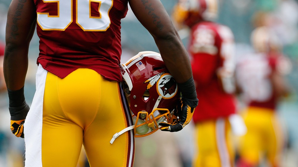 A Washington Redskins helmet is carried by Brian Orakpo #98 of the Washington Redskins before the game against the Philadelphia Eagles on Sept. 21, 2014 in Philadelphia.