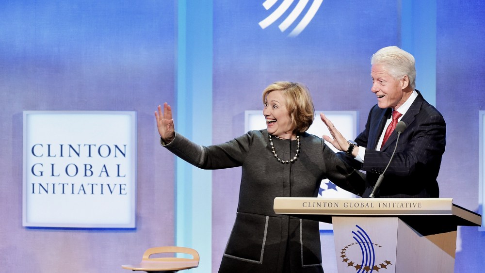 Former US Secretary of State Hillary Clinton and husband, Former U.S. President Bill Clinton address the audience during a meeting for the  Clinton Global Initiative on Sept. 22, 2014 in New York City.
