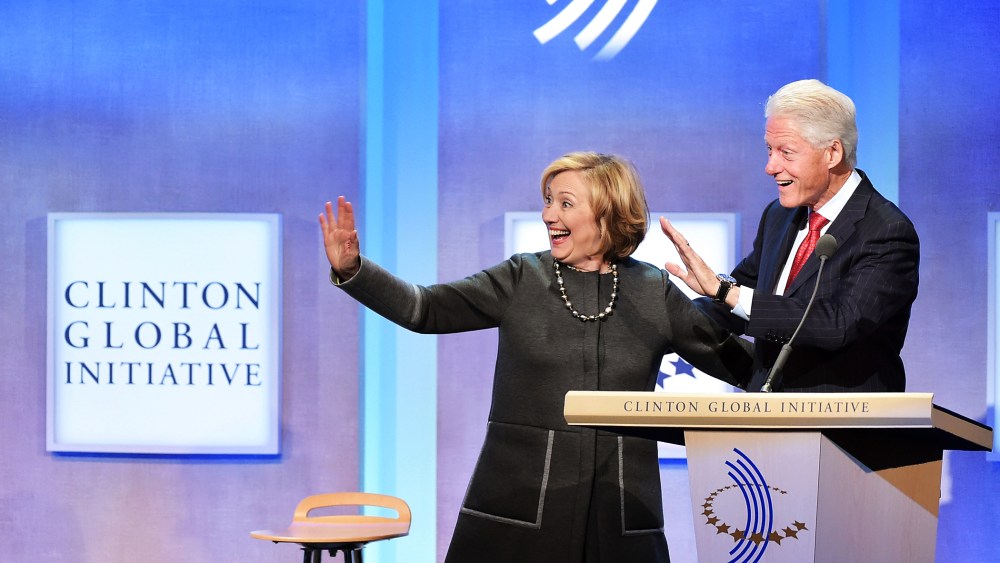 Former US Secretary of State Hillary Clinton and husband, Former U.S. President Bill Clinton address the audience during the Clinton Global Initiative on Sept. 22, 2014 New York, N.Y. (Photo by Michael Loccisano/Getty)
