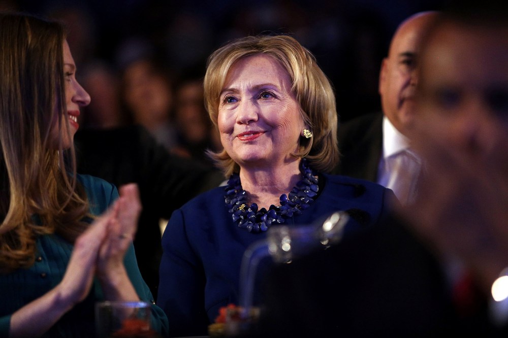 Former U.S. Secretary of State Hillary Clinton watch from the audience as U.S. President Barack Obama, speaks at the Clinton Global Initiative on Sept. 23, 2014 in New York City.