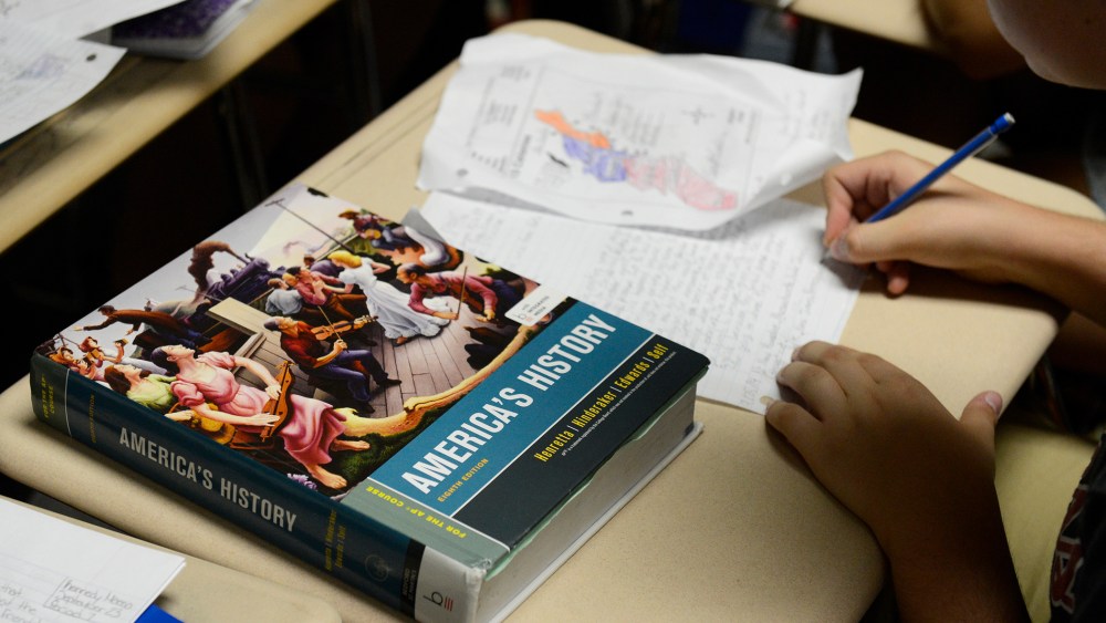 An America's History text book sits on a student's desk in an AP U.S. History class in Colorado. (Photo by Andy Cross/The Denver Post/Getty)