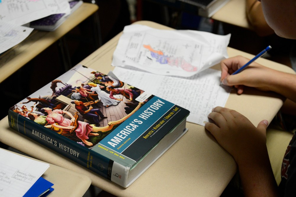 An America's History text book sits on a student's desk in an AP U.S. History class in Colorado. (Photo by Andy Cross/The Denver Post/Getty)