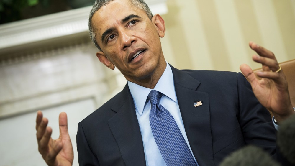 President Barack Obama makes a statement to the press in the Oval Office of the White House on Sept. 30, 2014 in Washington, D.C. (Photo by Brendan Smialowski/AFP/Getty)