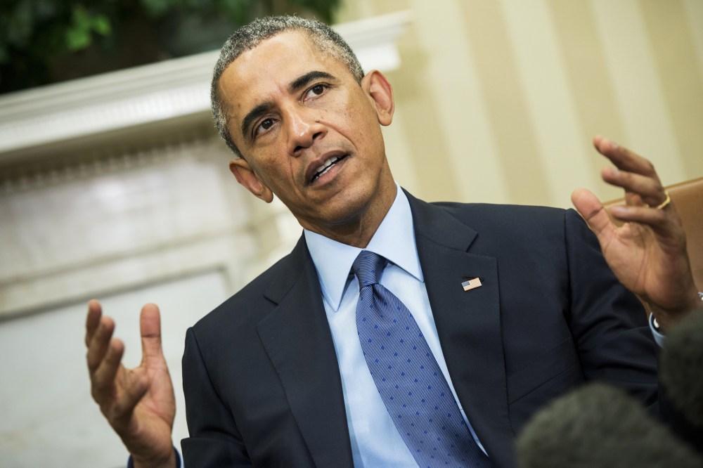 President Barack Obama makes a statement to the press in the Oval Office of the White House on Sept. 30, 2014 in Washington, D.C. (Photo by Brendan Smialowski/AFP/Getty)