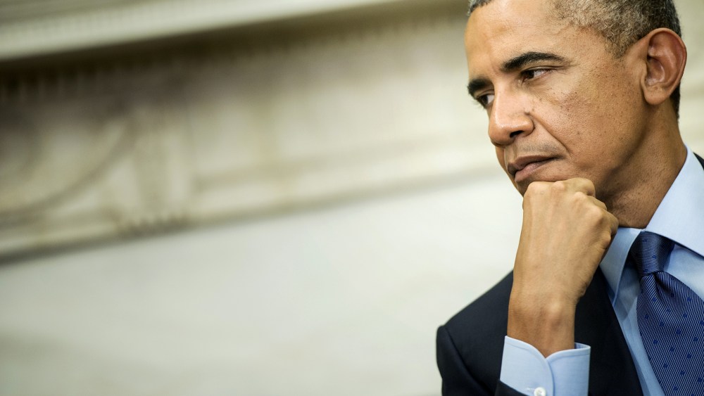 President Barack Obama listens during a meeting in the Oval Office on Sept. 30, 2014 in Washington, DC. (Photo by Brendan Smialowski/AFP/Getty)