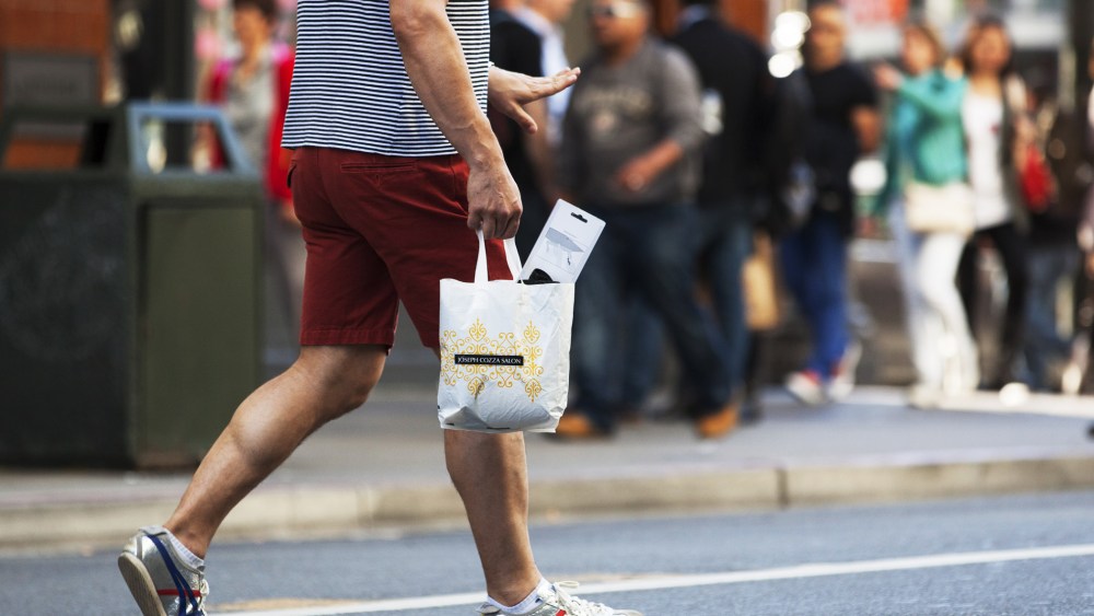 A man carries a plastic shopping bag on September 30, 2014  in San Francisco, California.