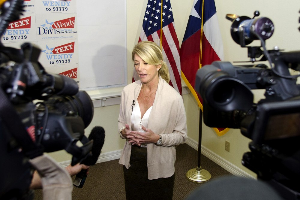 Texas Democrat State Senator Wendy Davis answers media questions during the opening of her gubernatorial campaign headquarters in Fort Worth, Texas, Dec. 14, 2013.
