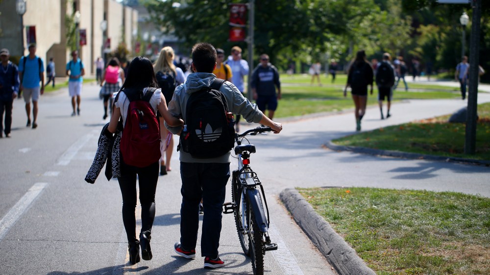 Students on the campus of UMass Amherst. (Photo by Jonathan Wiggs/Boston Globe/Getty)