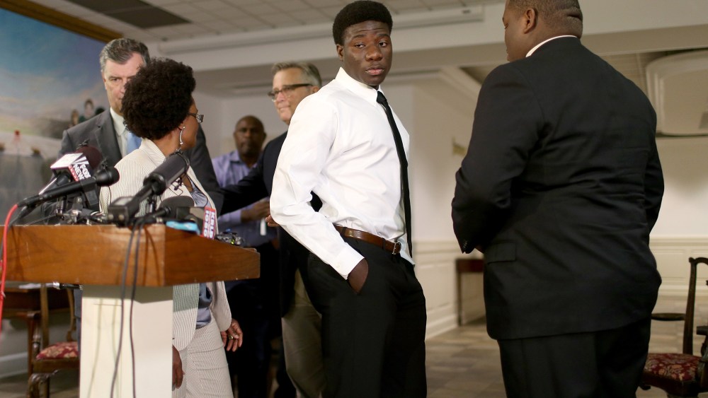 Karsiah Duncan, (C) the son of Ebola patient, Thomas Eric Duncan, leaves after speaking to the media at the Wilshire Baptist Church on Oct. 7, 2014 in Dallas, Texas.