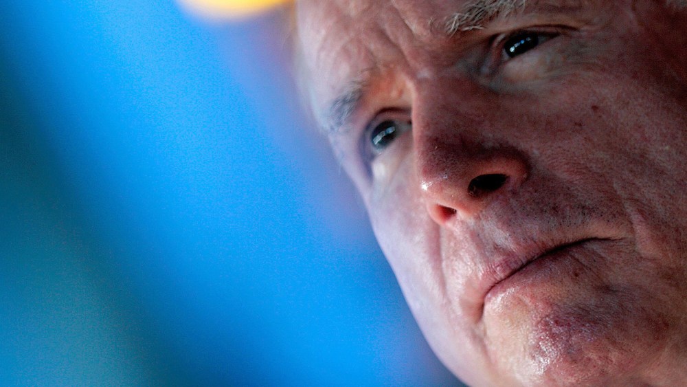Senator John McCain (R-AZ) (2nd L) speaks to members of the media on October 13, 2014 in Covington, Louisiana. (Photo by Sean Gardner/Getty)