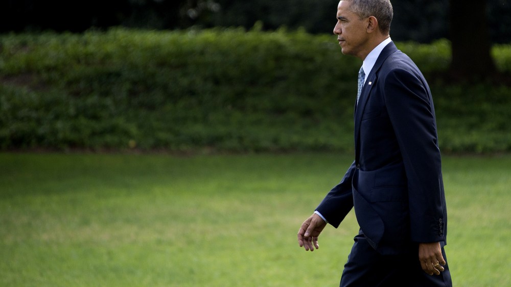 President Barack Obama departs the White House in Washington, D.C., on Oct. 14, 2014. (Photo by Jim Watson/AFP/Getty)