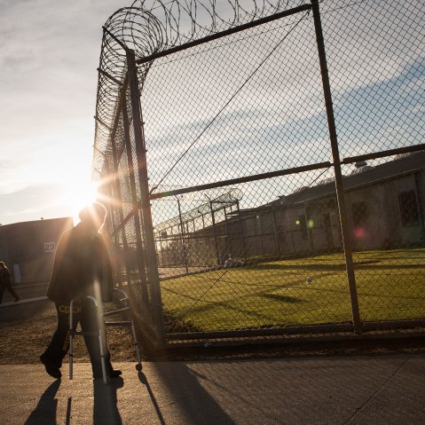 George Whitfield, age 56, uses a walker to get to the physical therapist's office at California State Prison, Solano, on December 16, 2013 in Vacaville, Calif.
