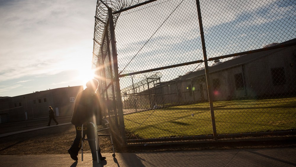 George Whitfield, age 56, uses a walker to get to the physical therapist's office at California State Prison, Solano, on December 16, 2013 in Vacaville, Calif.