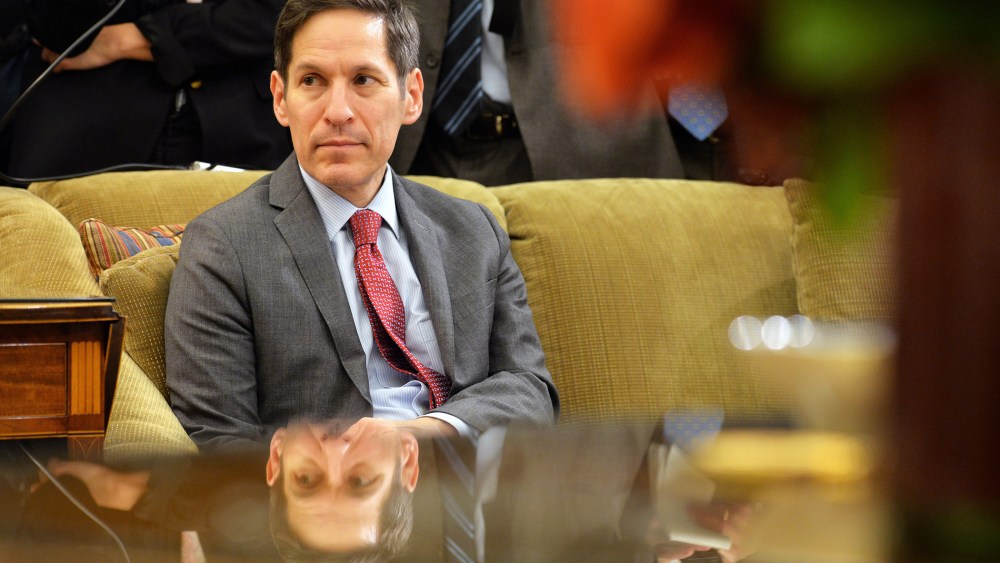 Dr. Thomas Frieden, director of the Centers for Disease Control and Prevention listens as President Barack Obama addresses the media in the Oval Office at the White House on Oct. 16, 2014 in Washington, DC. (Photo by Kevin Dietsch/Pool/Getty)