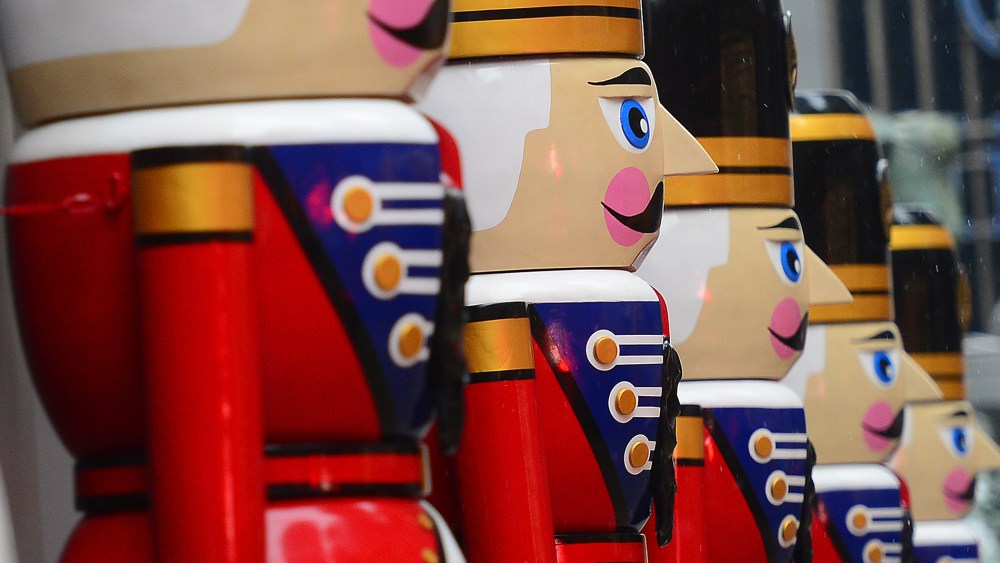 Giant nutcracker statues are set as holiday decorations in front of an office building in New York, Dec. 17, 2013