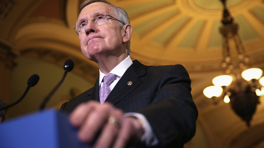 Senate Majority Leader Sen. Harry Reid (D-NV) speaks to members of the media after the weekly Senate Democratic Policy Committee luncheon, Dec. 17, 2013 on Capitol Hill in Washington, DC.
