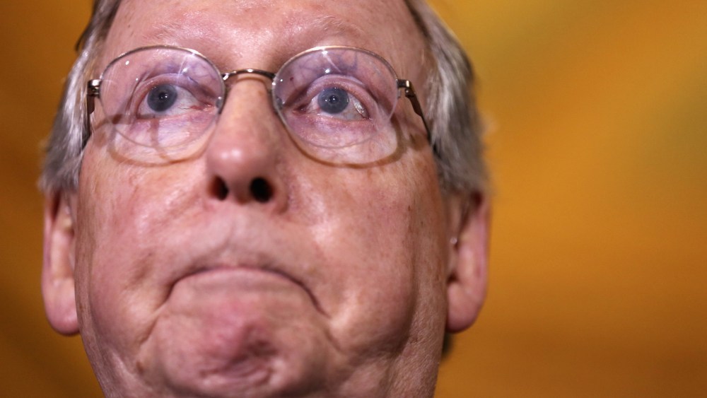 Senate Minority Leader Sen. Mitch McConnell (R-KY) pauses during a media briefing on December 17, 2013 on Capitol Hill in Washington, D.C.