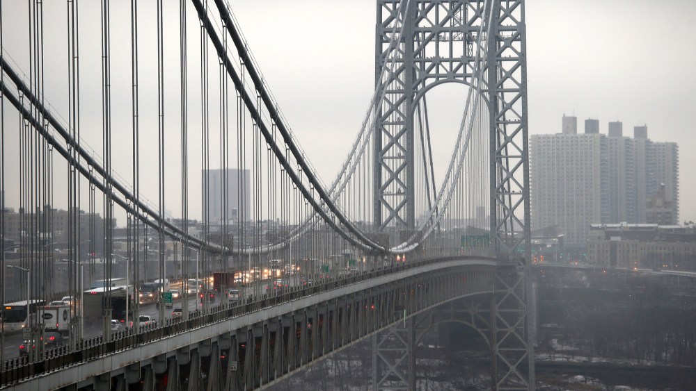 Traffic moves over the Hudson River and across the George Washington Bridge between New York City (R), and in Fort Lee, New Jersey on December 17, 2013.