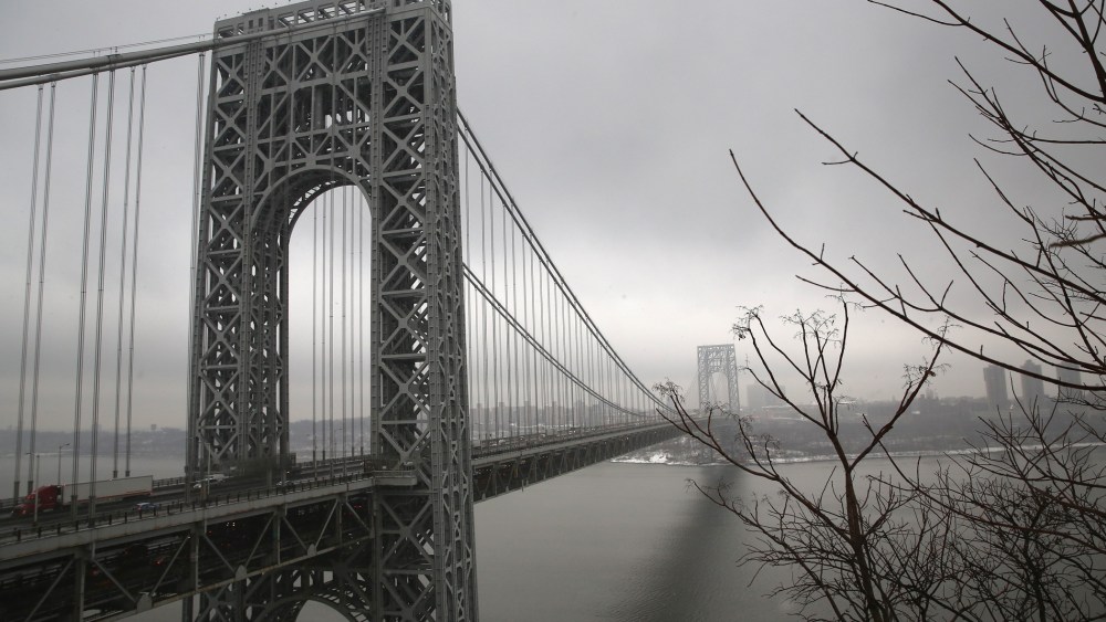Traffic moves over the Hudson River and across the George Washington Bridge between New York City (R), and Fort Lee, New Jersey on December 17, 2013.
