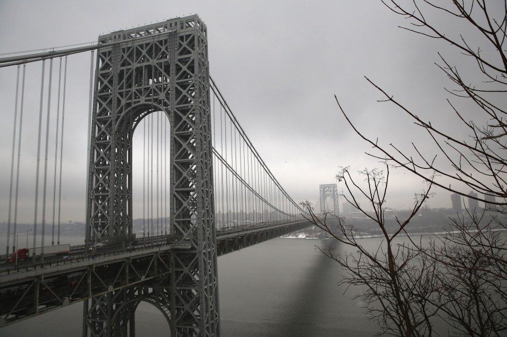 Traffic moves over the Hudson River and across the George Washington Bridge between New York City (R), and Fort Lee, New Jersey on December 17, 2013.